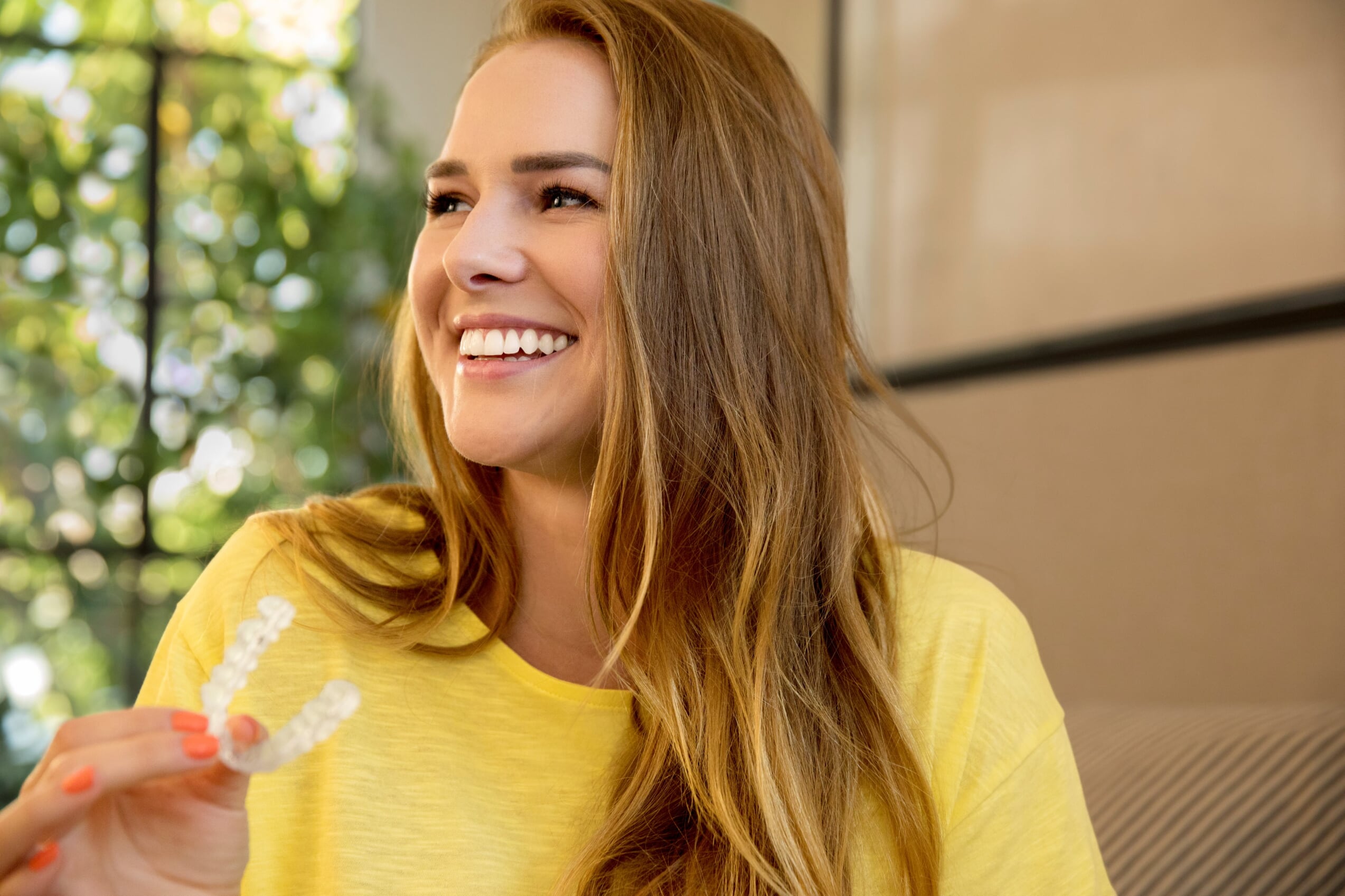 Patient smiling during orthodontic treatment